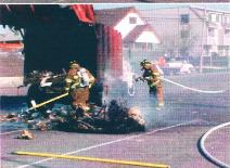 Trash truck fire at the Marina located at 80th St and the Bay in 2000