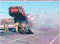 The contents of the trash truck fire were pulled out to make sure the fire was not still burning underneath. This fire was at the Marina Lot in 2000